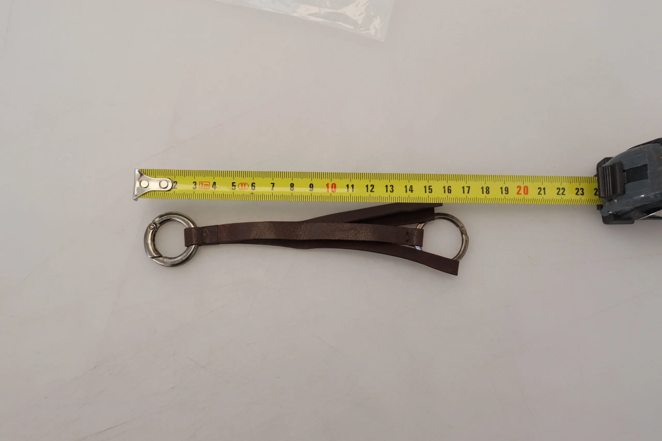Costume National Elegant Brass & Leather Keychain Charm